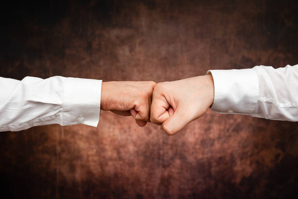 Corporate Businessmen Handshake Indoors.Two People Professionally Well Dressed Gesturing Togetherness.Working Colleague Partners Sign Deal In Agreement To Contract - Photo, Image