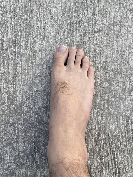 foot man on cement floor - Fotó, kép