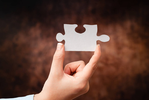 Hands Holding Two Pieces Of Jigsaw Puzzle.Cooperation For Finding And Resolving Missing Ideas At Work.Businessman Find Strategy For Resolving, Connecting Thoughts - Photo, Image