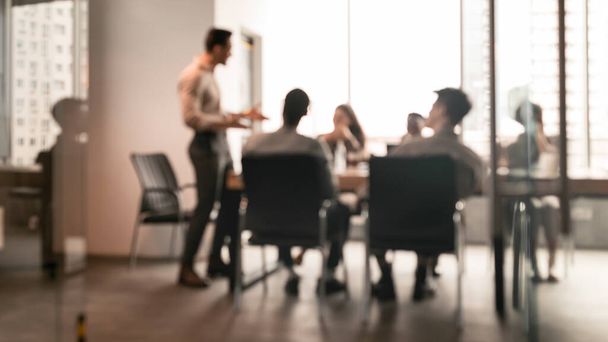 Colleagues having meeting in boardroom, businessman giving speech, blurred photo - Photo, Image