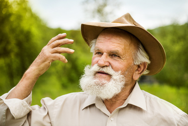 Old farmer in hat - Fotoğraf, Görsel