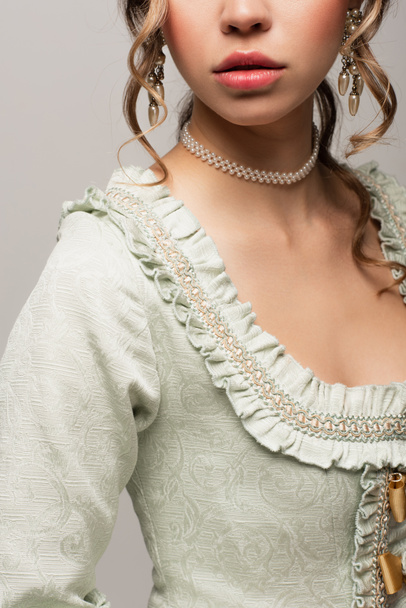 cropped view of young woman in vintage dress posing isolated on grey - Valokuva, kuva