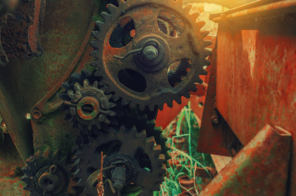 Rusty old metal gears in broken combine unit - Photo, Image