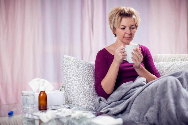 Woman with short blond hair got the flu and treated at home. People, healthcare and medicine concept - Valokuva, kuva