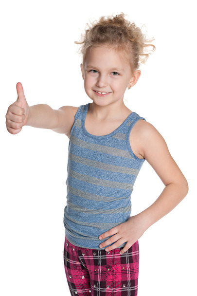 Cheerful young girl holds her thumbs up - Фото, зображення