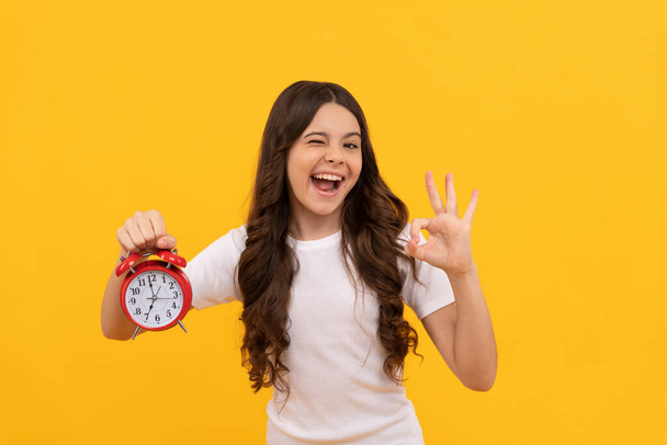 happy kid hold retro alarm clock showing time, ok - Photo, Image