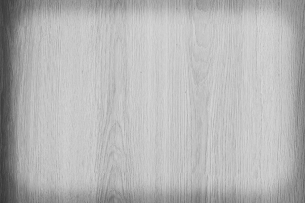 Old plywood surface made into a black and white image. The softness of the ply stripes plywood surface for the background. Black and white background of old plywood texture. - Photo, Image