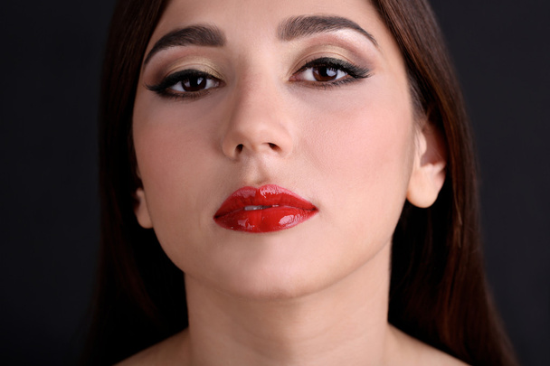 Girl with red lips on dark background - Photo, Image