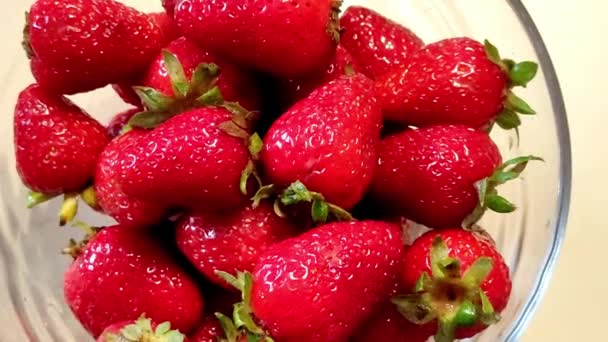Man hand takes strawberries from a bowl.  - Footage, Video