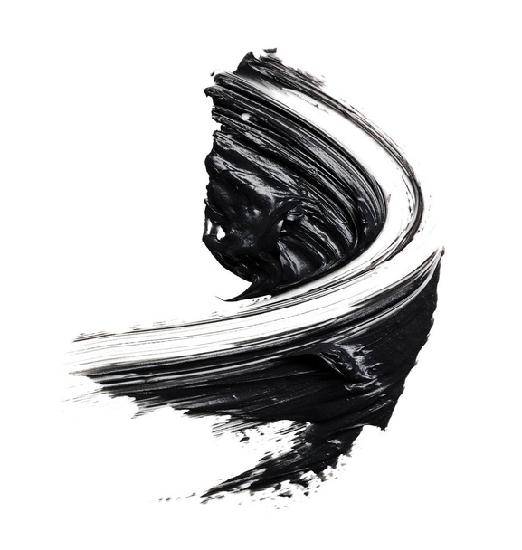 Rozmazaná černá řasenka izolovaná na bílém pozadí. Hodinky kosmetického přípravku. Tah štětce - Fotografie, Obrázek