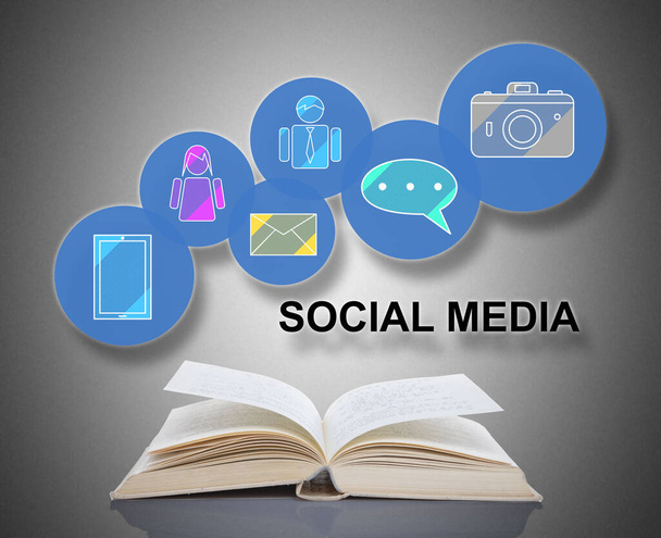 Social media concept above an open book - Photo, Image