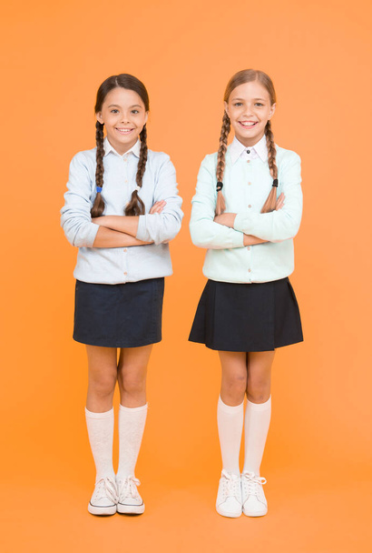 Cheerful mood concept. School friendship. Support and friendship. Problem relations. Friendly relationship. Friendship goals. Cute school girls classmates. First school day. Sisterhood and friendship - Photo, Image