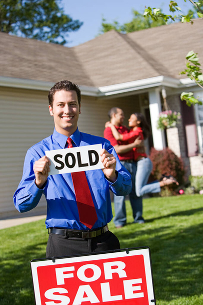 Extensive series of a Caucasian Real Estate Agent and African-American Couple in front of a home. - Foto, Bild