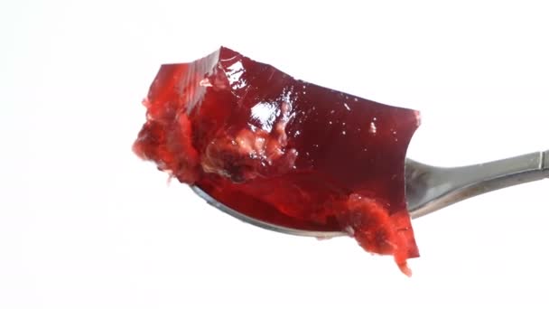 Fruit jelly with fresh strawberry. Healthy food. Strawberry jelly on white background. Summer dessert with fruit jelly and fresh strawberry. - Footage, Video