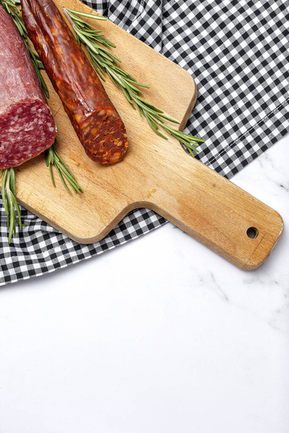 Assortment of typical Spanish homemade sausages with a colorful background. Iberian Chorizo and Salchichon - Foto, Bild