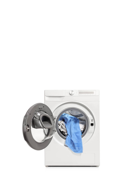 Studio shot of an open washing machine with clothes inside isolated on white background - Zdjęcie, obraz