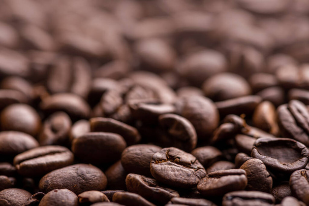 Roasted coffee beans. Background and macro - Фото, зображення