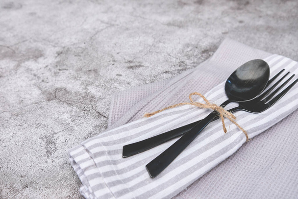 Decorated cutlery, fork and knife on a blue napkin, mockup. Selective focus - Fotografie, Obrázek
