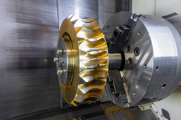 Gear processing on a CNC machine made of bronze, close-up gear cutting production. - Photo, Image