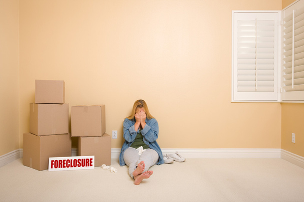 Upset Woman on Floor Next to Boxes and Foreclosure Sign - Photo, Image