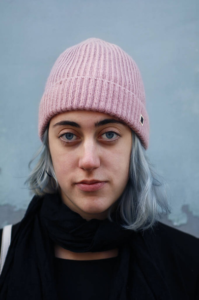 portrait of Young woman with pink cap and silver hair - Photo, Image