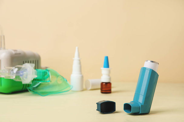 Modern inhaler on color wooden background - Photo, Image