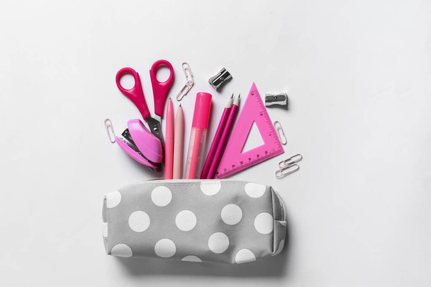 Pencil case with stationery on white background - Photo, Image