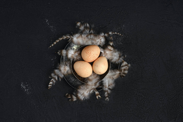 Three guinea fowl eggs in metal bowl - Fotoğraf, Görsel