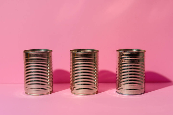 Canned food tin on pink studio background - Foto, Bild