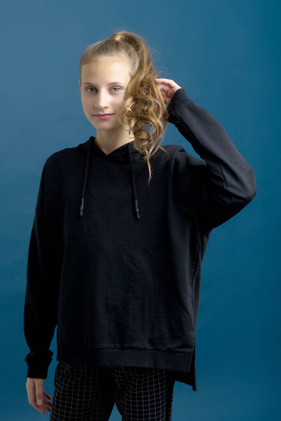 Pretty teenage girl in black stylish clothes - Fotó, kép