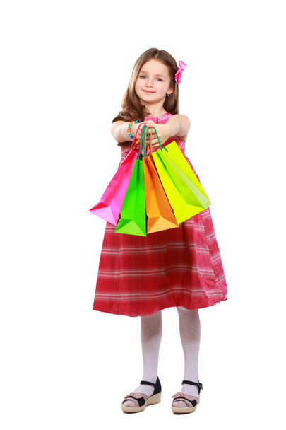 little girl with shopping bags over white background - Fotografie, Obrázek