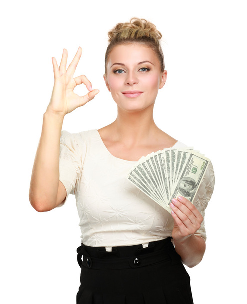 Young woman with dollar notes in her hand. Isolated on white background - Photo, Image