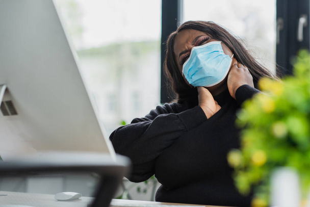 african american plus size businesswoman in medical mask touching neck  - Photo, Image