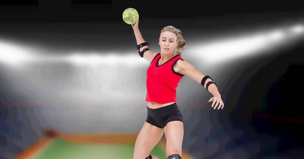 Composition of female volleyball player jumping throwing ball over blurred indoor court background. sport and competition concept digitally generated image. - 写真・画像
