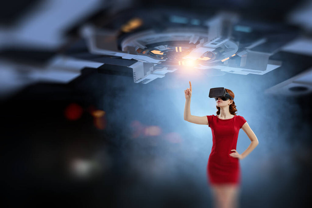 Woman wearing virtual reality goggles - Foto, imagen