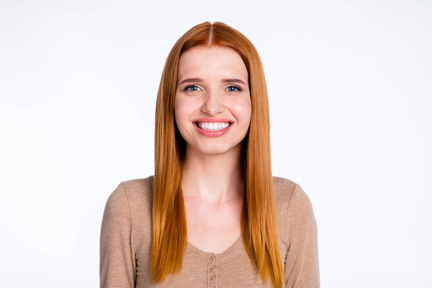 Photo of sweet charming redhair woman beige shirt smiling isolated white color background - Fotoğraf, Görsel