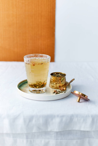 ginger tea in a glass on the table - Φωτογραφία, εικόνα