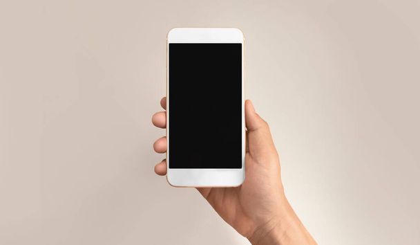 Hand holding smartphone device and touching screen - Φωτογραφία, εικόνα