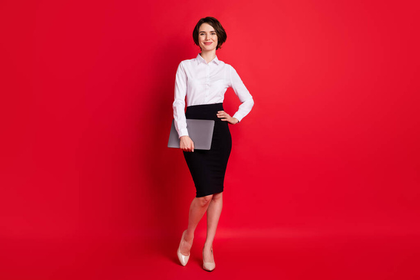 Full length body profile photo confident business woman keeping laptop smiling isolated bright red color background - Photo, image
