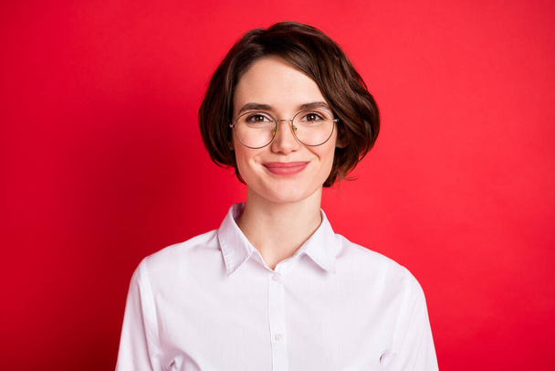 Photo portrait of happy business woman wearing glasses formal wear smiling isolated vibrant red color background - Photo, Image