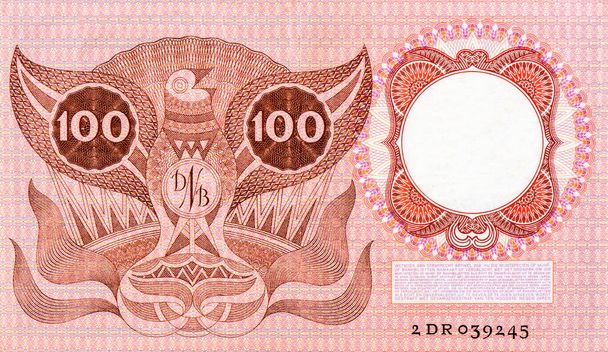 Стилизованная птица., Портрет из Голландии 100 Gulden1953 Banknotes. - Фото, изображение