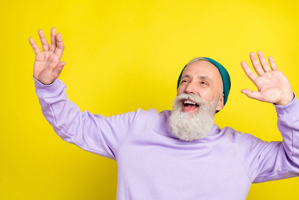 Photo portrait of aged man chilling relaxing dancing at party looking copyspace isolated vivid yellow color background - Фото, зображення