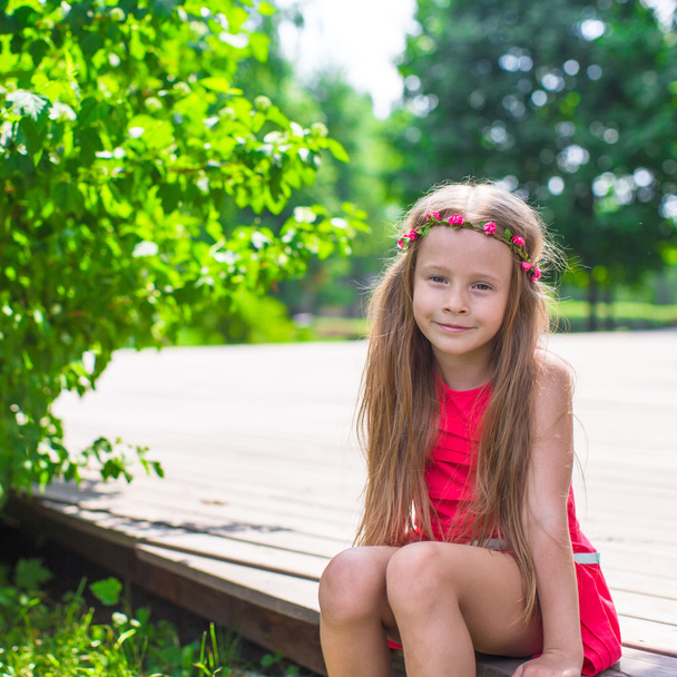 Portrait of adorable little girl on a warm summer day - Photo, Image