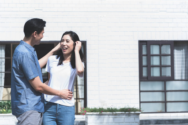 Portrait images, An Asian couple, husband and attractive wife, are happiness with new home where they are relocation background, to beginning of family life concept. - Photo, Image