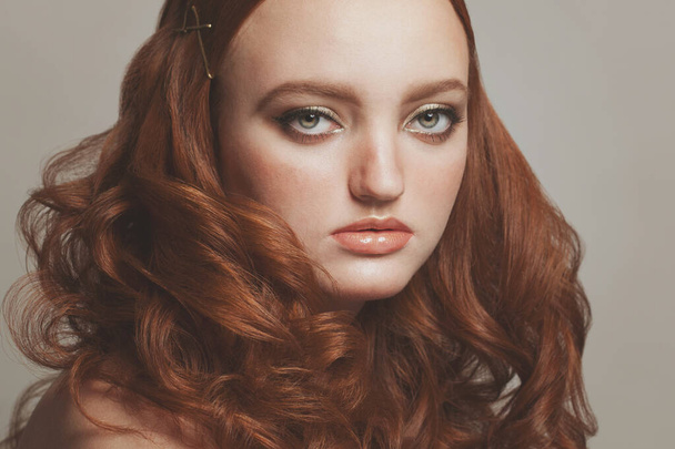 Fashionable portrait of young ginger female, beautiful woman face close up - 写真・画像
