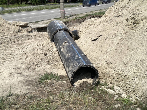 Repair of city water supply and sewerage, replacement of pipes and locking devices. Replacement of old pipes in sandy soil - Photo, Image