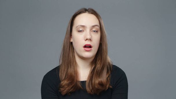 Photo of drunk girl in black shirt, close-up - Foto, afbeelding