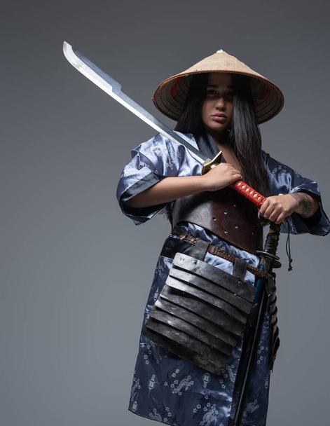 Female samurai with sword and bamboo hat - Φωτογραφία, εικόνα