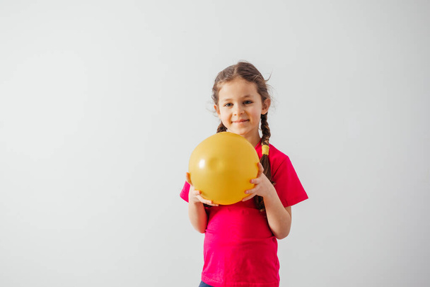 Adorble girl with sport ball prepared for sport - Фото, изображение