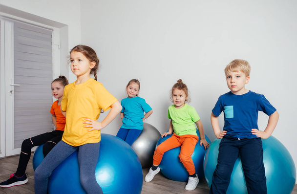 Engaged kids while physical education lessons at preschool - Fotoğraf, Görsel